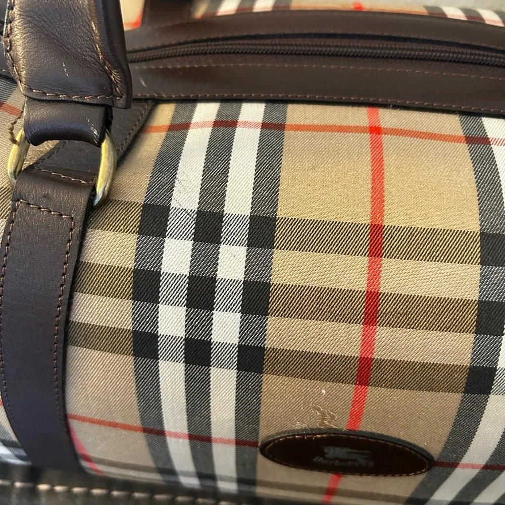 Burberrys Haymarket Boston Tan Duffel with Brown Leather Trim 10H x 19W inches